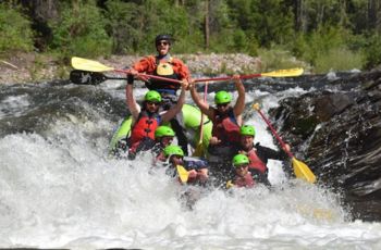 This is a picture of some people doing river rafting.